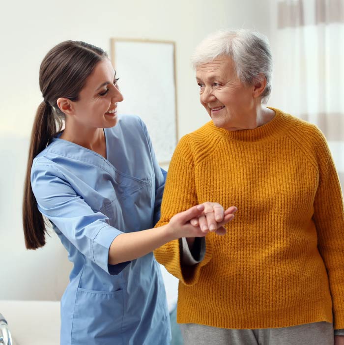 Compassionate caregiver providing personalized assistance with daily living activities for a senior at home, promoting independence and enhancing quality of life