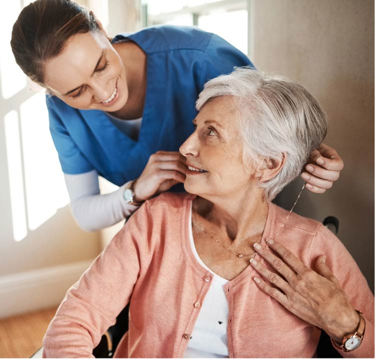 woman Senior enjoying a conversation with a companion caregiver at home in kings california